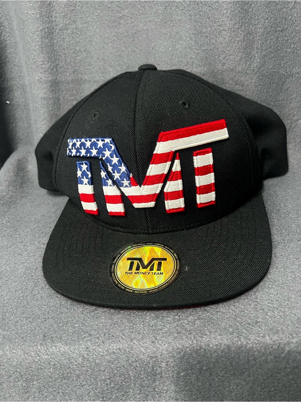 TMT The Money Team snapback hat featuring a US flag colorway